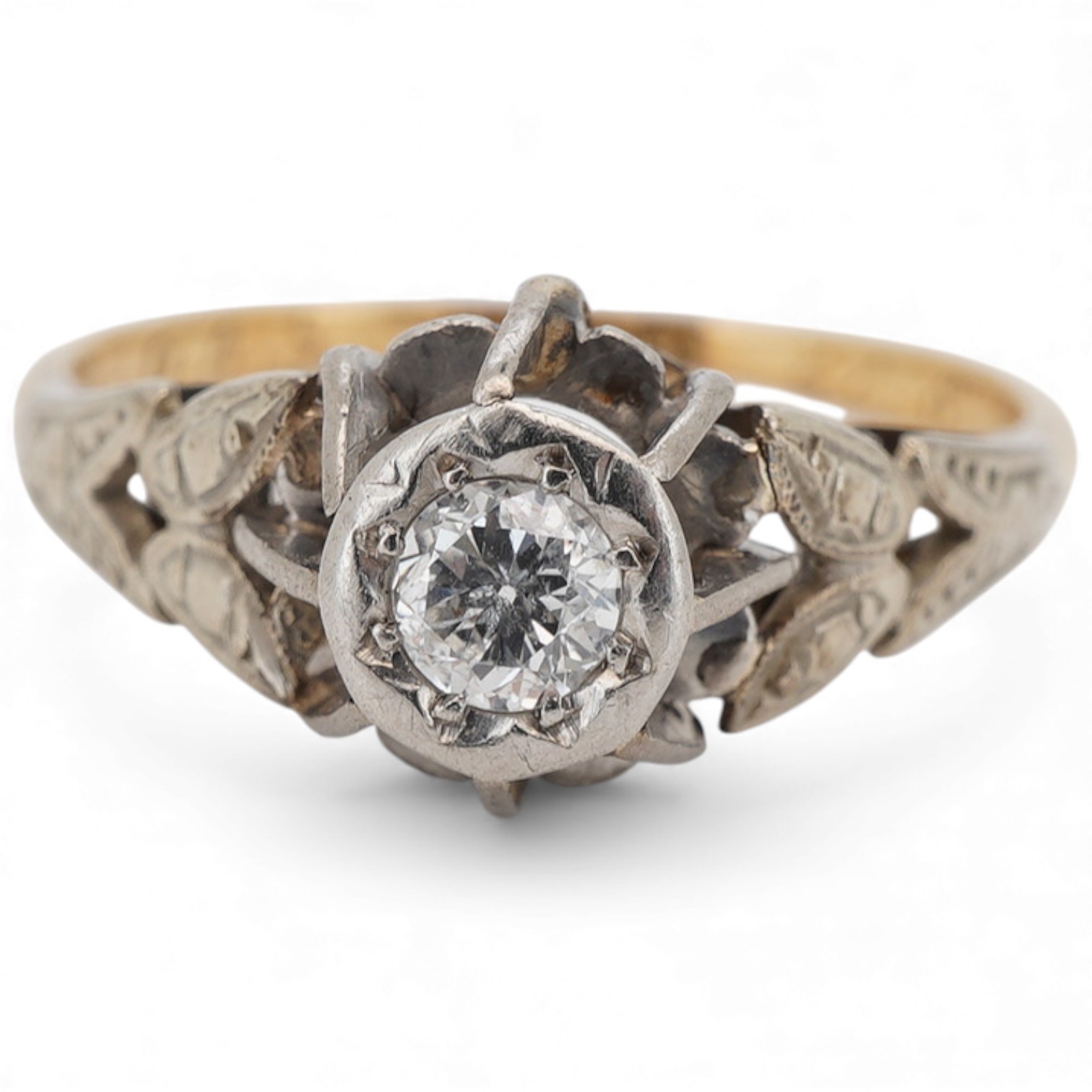 A yellow metal and illusion set single stone diamond ring, stamped 18ct & plat, size M, gross weight 2.3 grams.